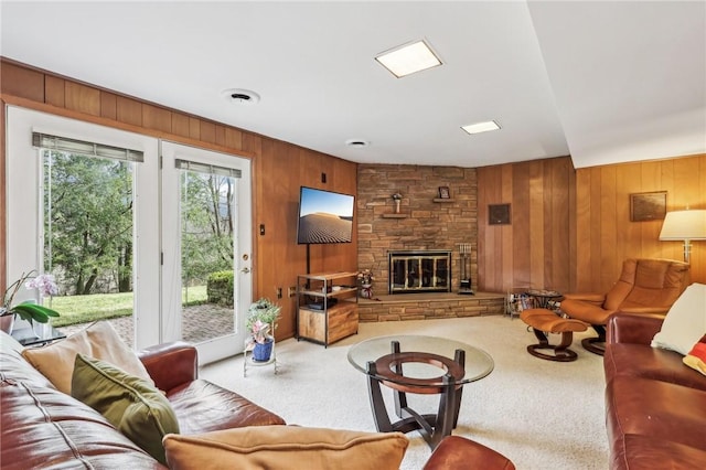 carpeted living room featuring a fireplace