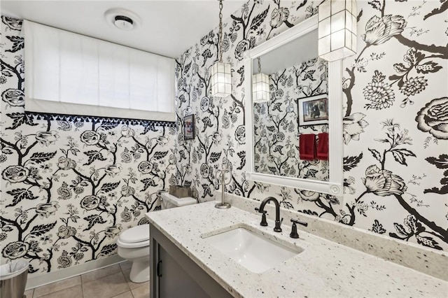 bathroom featuring tile patterned floors, vanity, and toilet