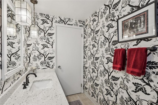 bathroom with tile patterned floors and vanity