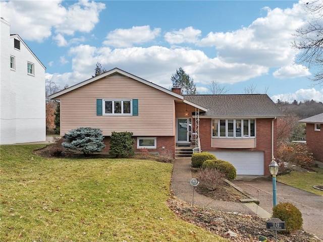 split level home featuring a garage and a front lawn