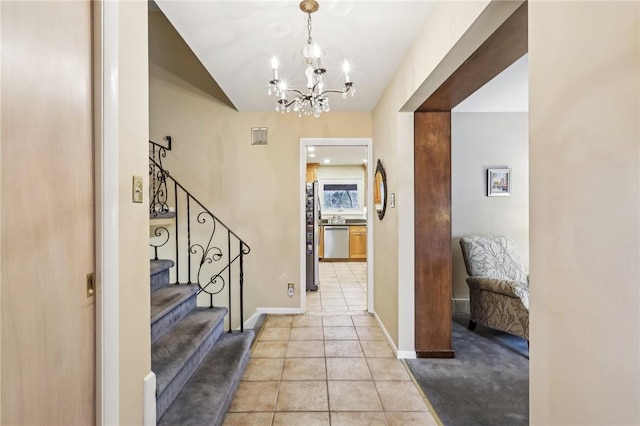 foyer entrance featuring a chandelier and light tile patterned floors