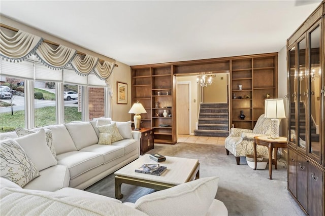 living room with built in shelves and light carpet