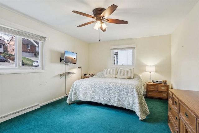 carpeted bedroom featuring ceiling fan and a baseboard heating unit