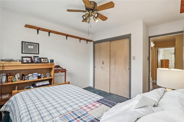 bedroom with ceiling fan and a closet