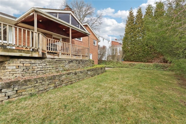 back of house featuring a lawn