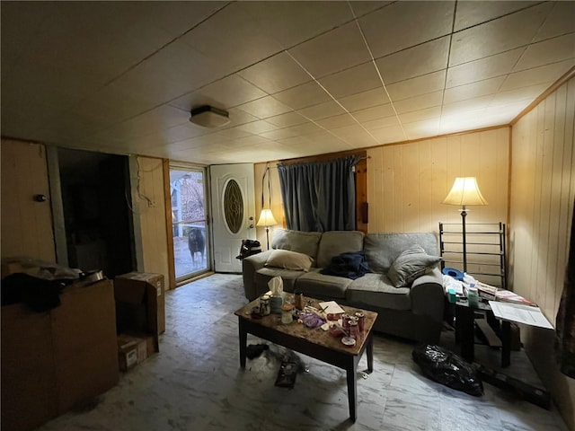 sitting room featuring wooden walls