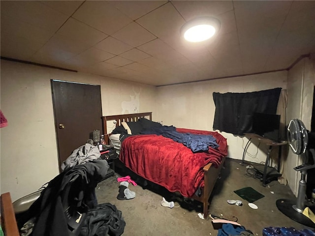 bedroom featuring concrete floors