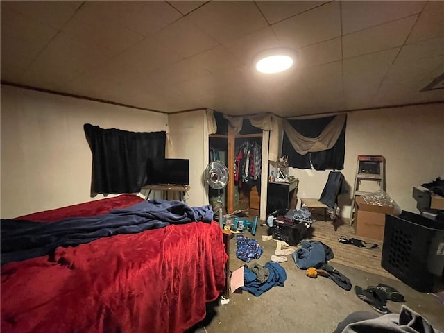 bedroom featuring concrete flooring