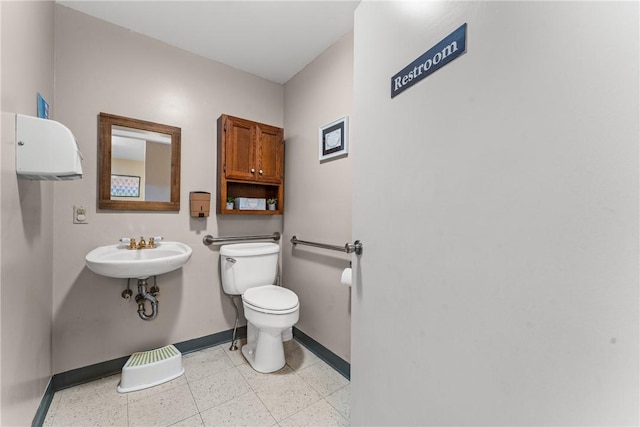 bathroom with sink and toilet