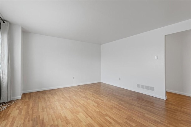 spare room featuring light hardwood / wood-style flooring