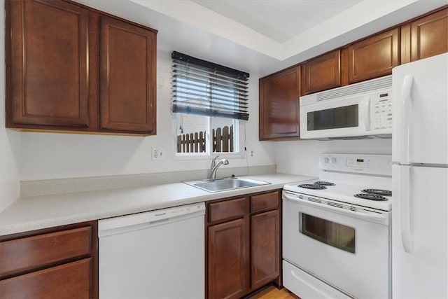 kitchen with white appliances and sink