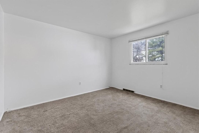 unfurnished room with carpet floors