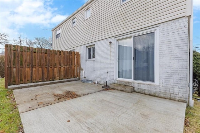 view of side of home featuring a patio area