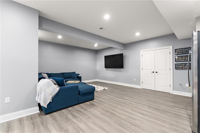 sitting room featuring light hardwood / wood-style flooring