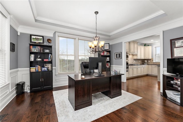 office with crown molding, a notable chandelier, dark hardwood / wood-style flooring, and a tray ceiling