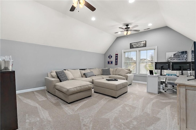 carpeted living room with ceiling fan and vaulted ceiling