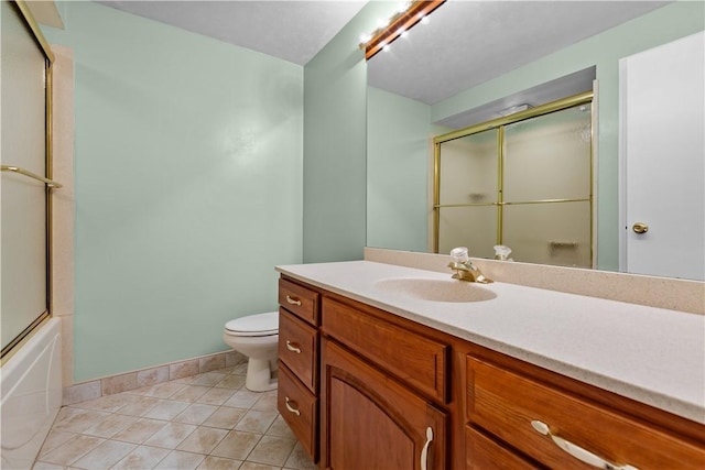 full bathroom with tile patterned flooring, vanity, toilet, and combined bath / shower with glass door