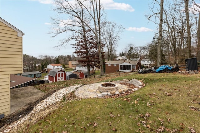 view of yard with an outdoor fire pit