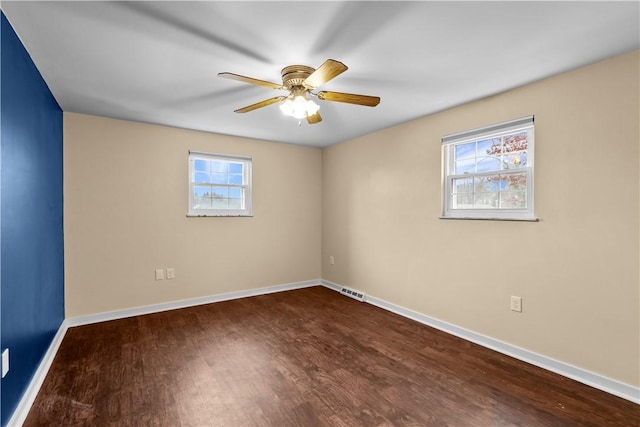 empty room featuring hardwood / wood-style flooring and ceiling fan