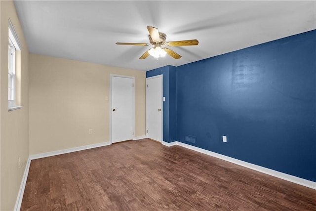 unfurnished room featuring hardwood / wood-style flooring and ceiling fan