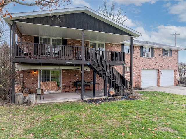 back of property featuring a patio area, a yard, and a garage