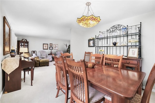 view of carpeted dining area