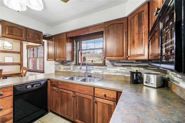 kitchen with backsplash, dishwasher, light tile patterned flooring, and sink