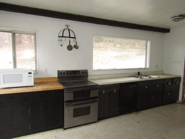 kitchen with stainless steel range with electric stovetop and sink