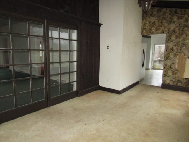 unfurnished room featuring concrete flooring