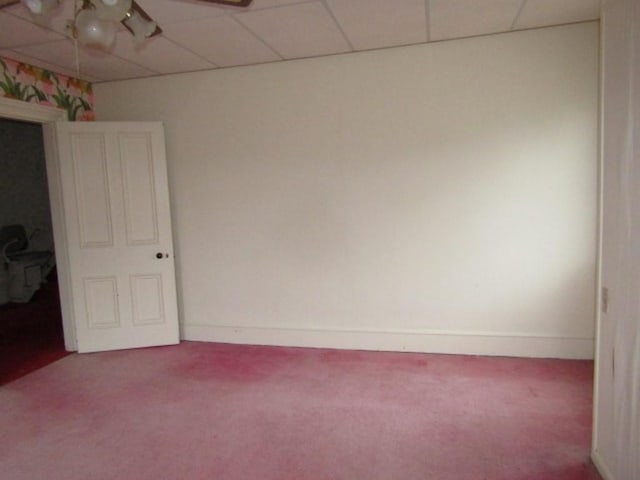 unfurnished room with carpet and a paneled ceiling