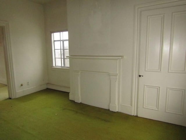 spare room with light colored carpet