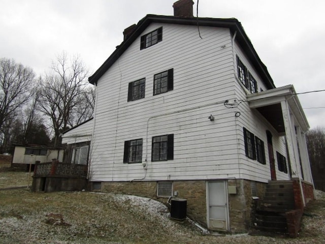 view of side of property featuring cooling unit