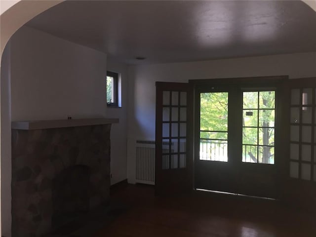 entryway featuring french doors and radiator