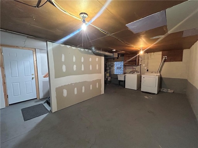 basement featuring sink and washer and clothes dryer