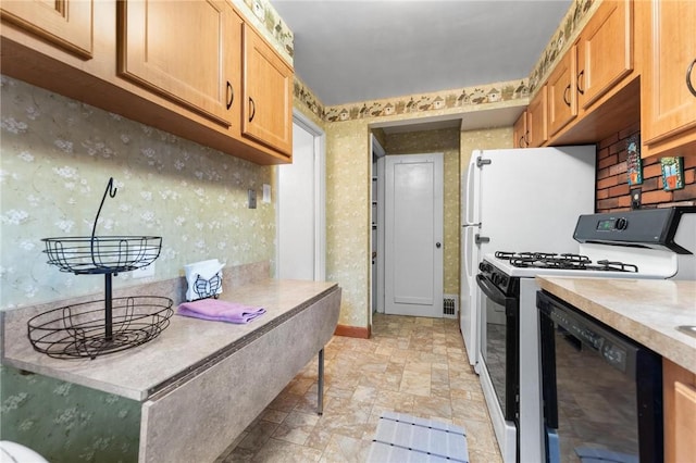 kitchen with dishwasher and white gas range