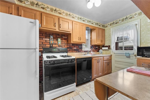 kitchen featuring sink and white appliances