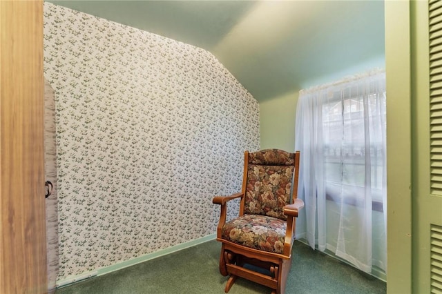 living area featuring carpet floors and vaulted ceiling