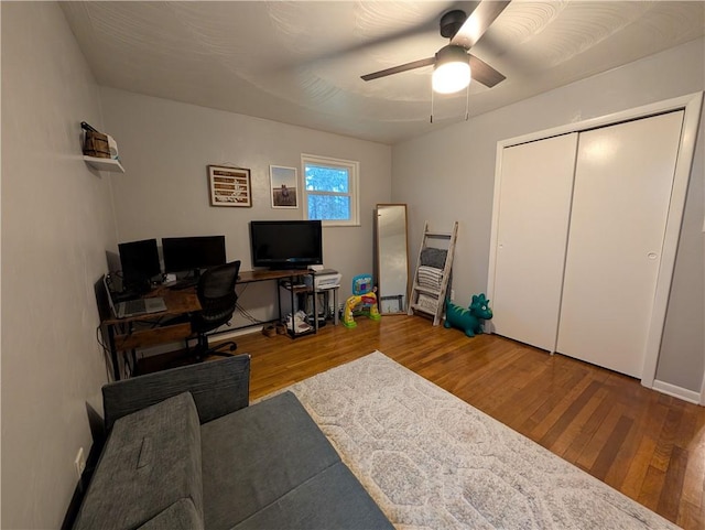 home office with ceiling fan and wood-type flooring