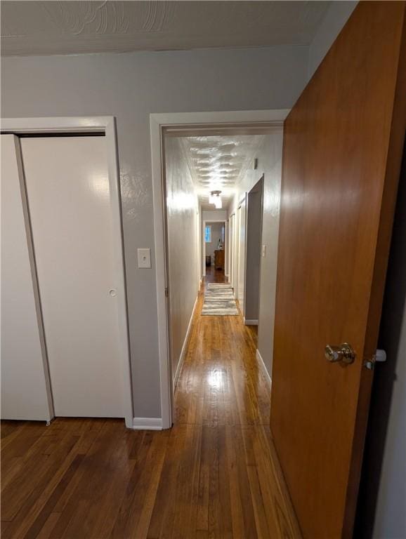 corridor featuring wood-type flooring