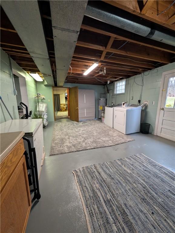 basement with gas water heater and independent washer and dryer