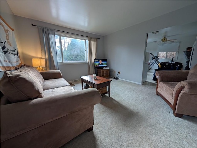 living room with carpet and ceiling fan