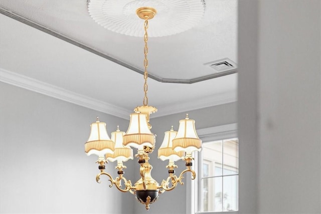 room details featuring crown molding and a notable chandelier