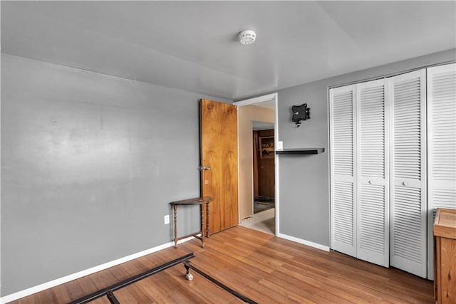 bedroom with a closet and light wood-type flooring