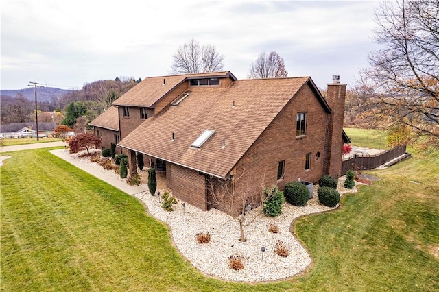 view of property exterior featuring a lawn