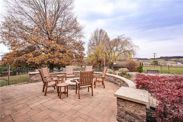 view of patio / terrace featuring a fire pit