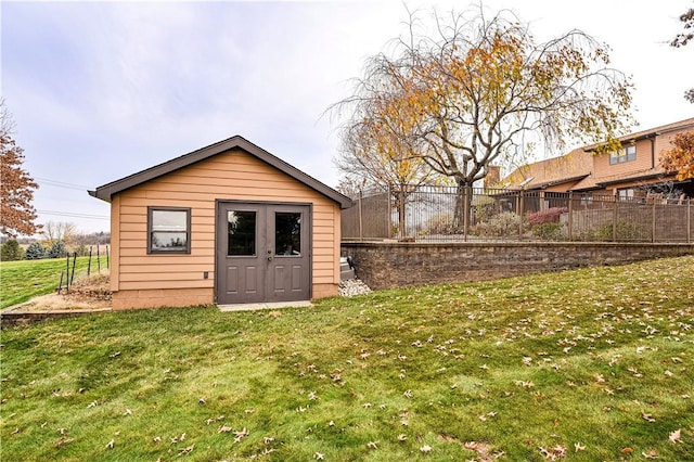 view of outdoor structure with a lawn