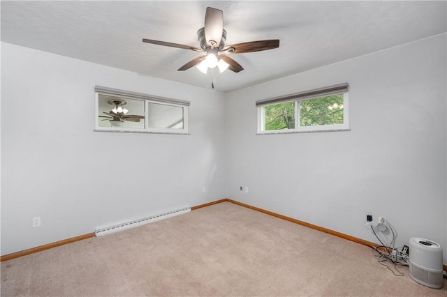 empty room with light carpet and a baseboard heating unit