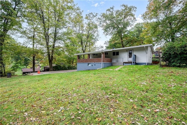 rear view of house with a lawn