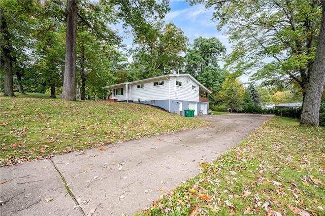 view of home's exterior featuring a lawn