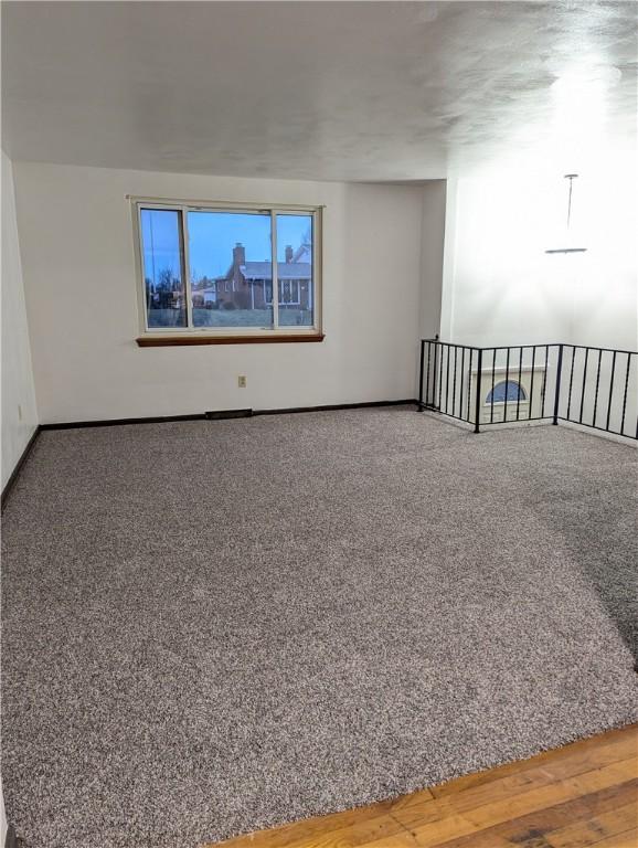 empty room featuring hardwood / wood-style flooring